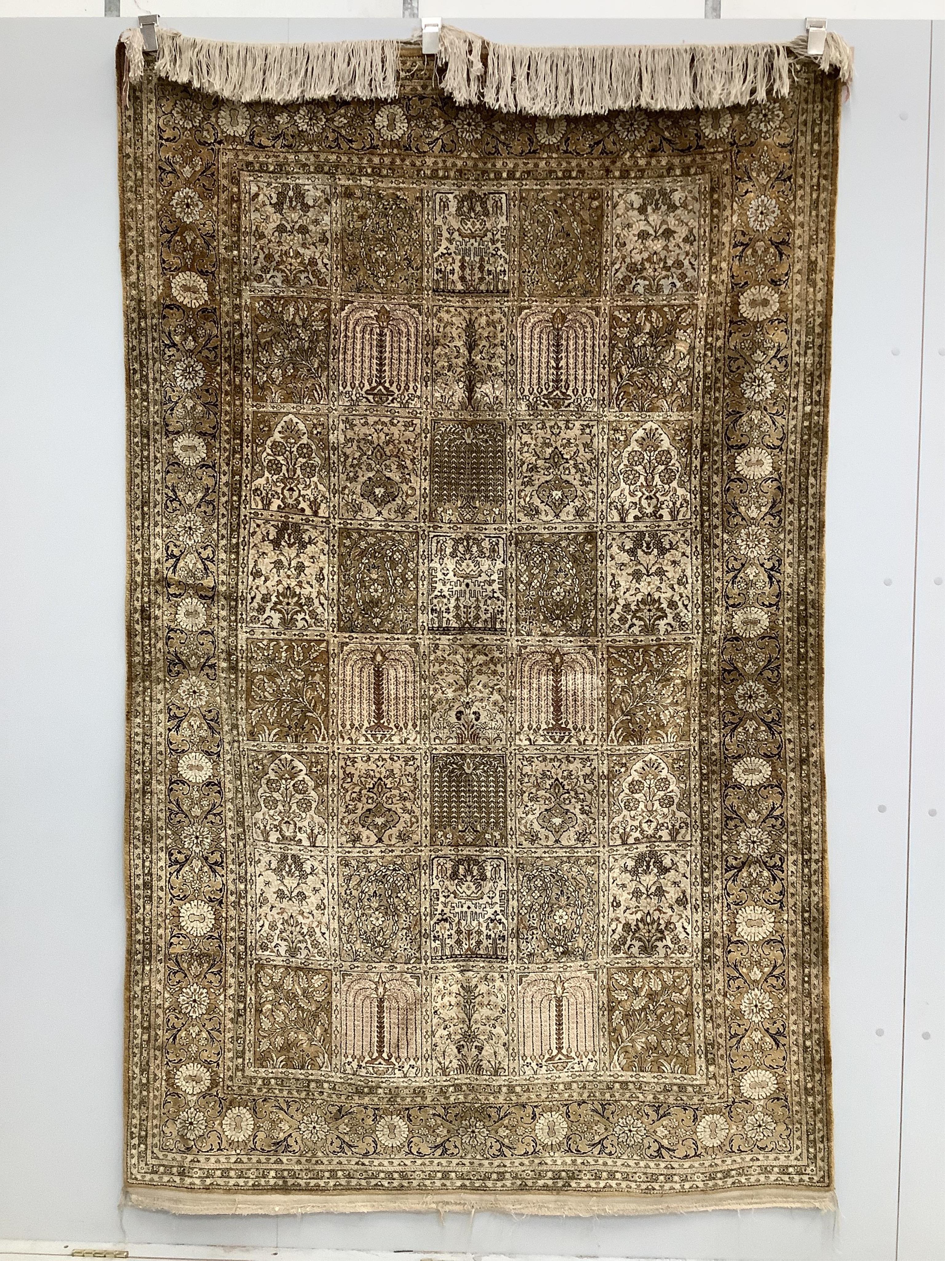 A Kashmir ‘silk’ rug, woven all over with rectangles filled with stylised flowers, 220 x 138cm